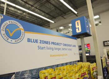 Sherm's Thunderbird grocery store in Klamath Falls features Blue Zones Project signs over healthy choice foods.