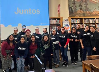 A group of Juntos families and students in Wasco County wearing matching black shirts.