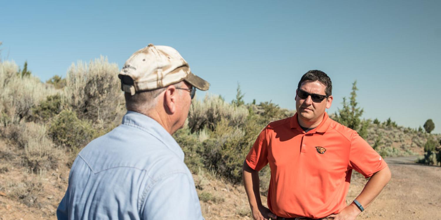 Sergio Arispe, associate professor and Extension livestock and rangeland specialist in Malheur County, meets with a rancher to talk about cattle.
