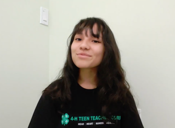 A teenage girl, one of the 4-H Teen teachers