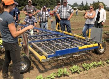 Clare Sullivan teaches growers about mechanical weed removal techniques and demonstrating a precision-tine harrow during the 2018 Cultivation Field Day.