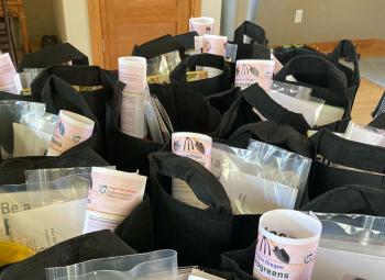Project PLANT bags are filled with fabric growing pots, packaged seeds and educational materials.